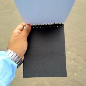 BLACK NOTEBOOK OUTSIDE